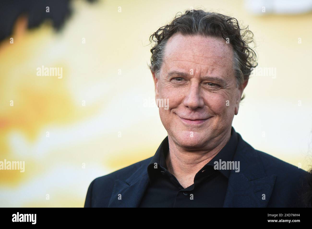 Judge Reinhold arrives at the premiere of 