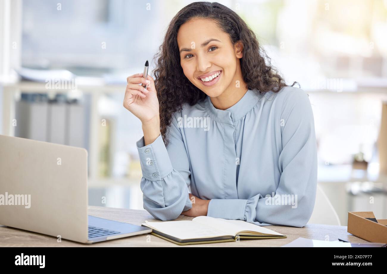 Business woman, computer and writing in notebook for copywriting ...