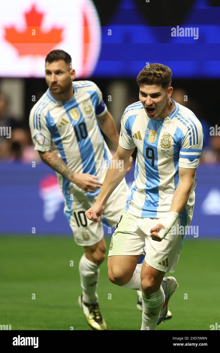 Argentina's forward Julian Alvarez (R) celebrates with his teammate forward Lionel Messi after scoring the team’s first goal against Canada during the Copa America USA 2024, group A, groupe stage match between Argentina and Canada, at Mercedes Benz stadium in Atlanta, on June 20, 2024. Stock Photo