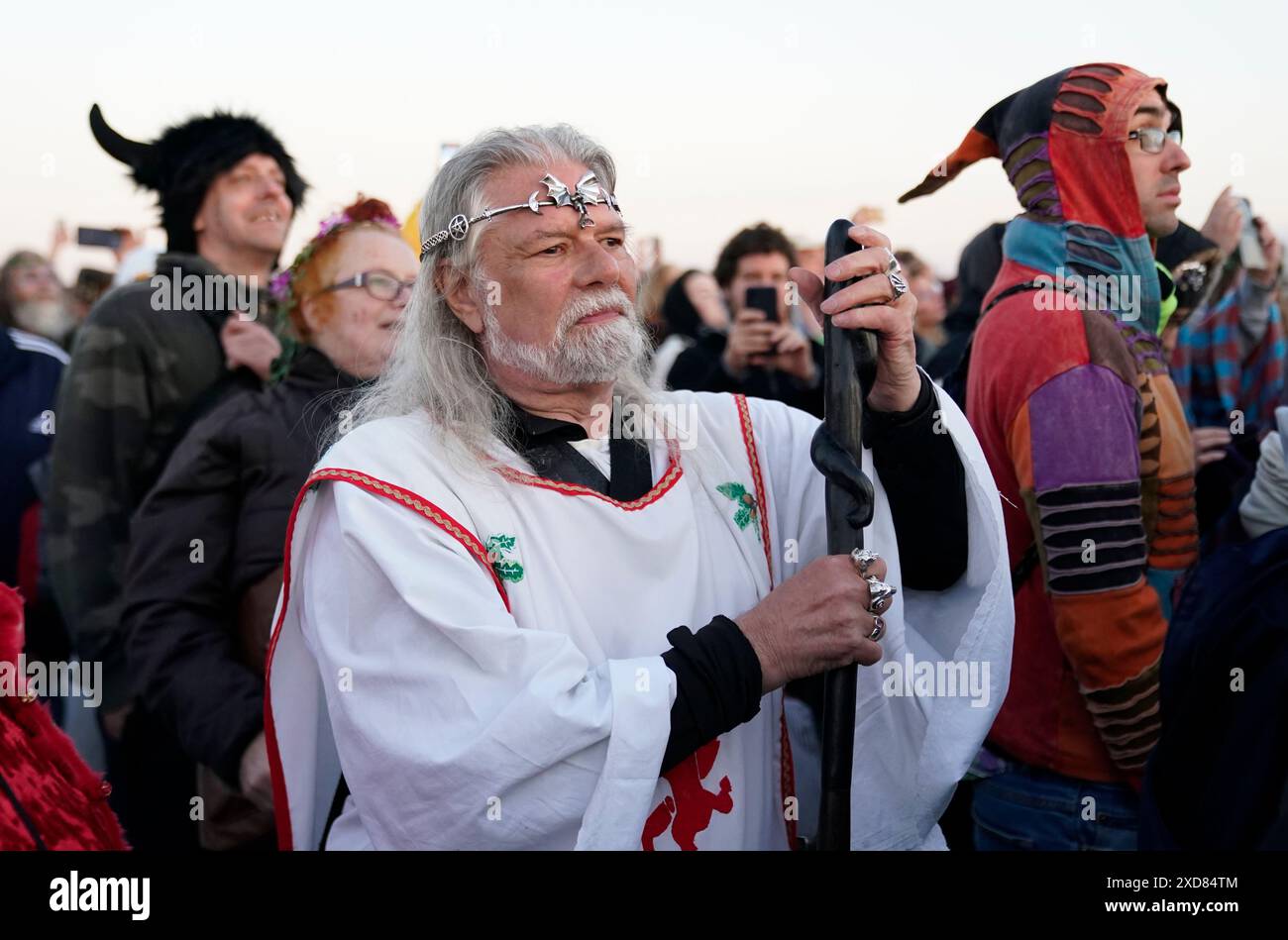 Arthur Pendragon watches the sun rise, as people take part in the