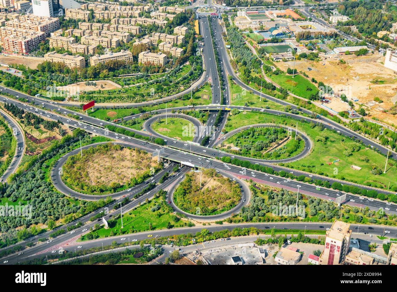 Aerial view of two-level road junction in Tehran, Iran. Day traffic of ...