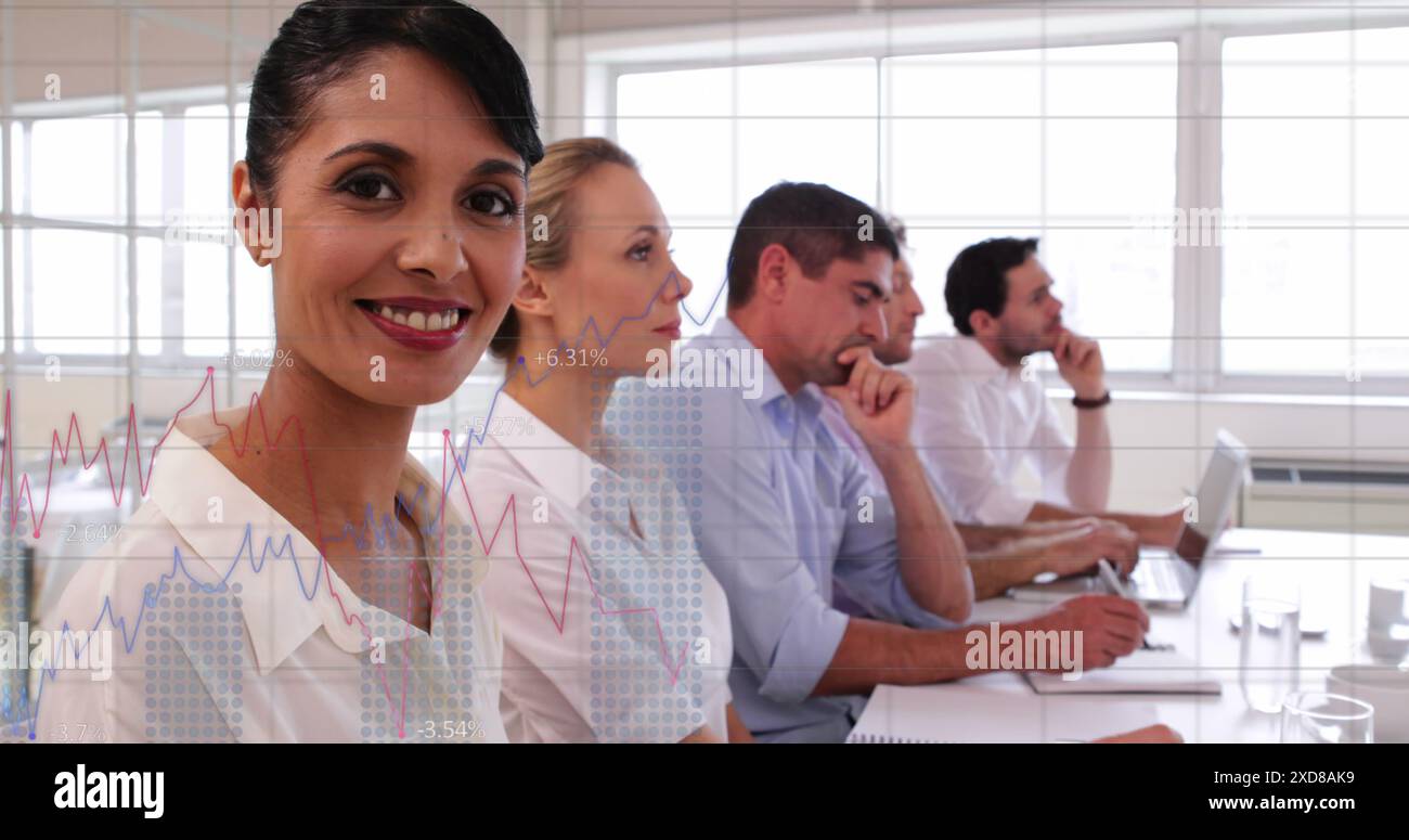 Image of statistical data processing against biracial woman smiling at office Stock Photo