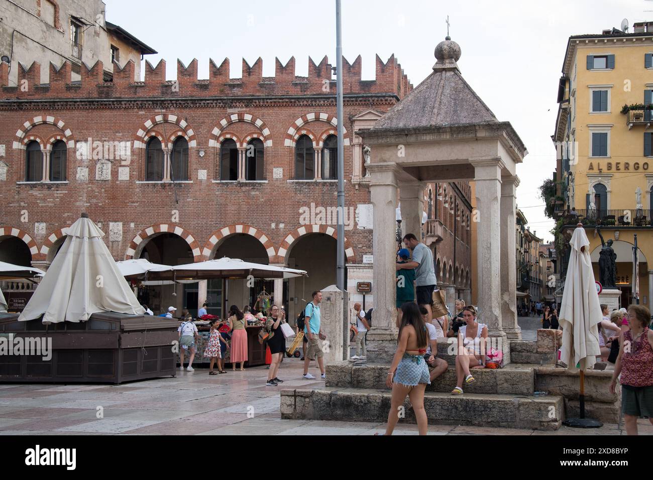 Romaneque Capitello (Tribuna) from XIII century for Podesta and Romanesque Domus Mercatorum or Casa dei Mercanti (House of guild of merchants) from XI Stock Photo