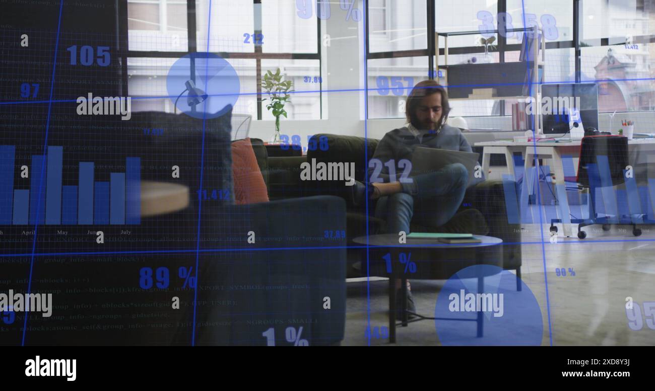 Image of statistical data processing against caucasian man using laptop at office Stock Photo