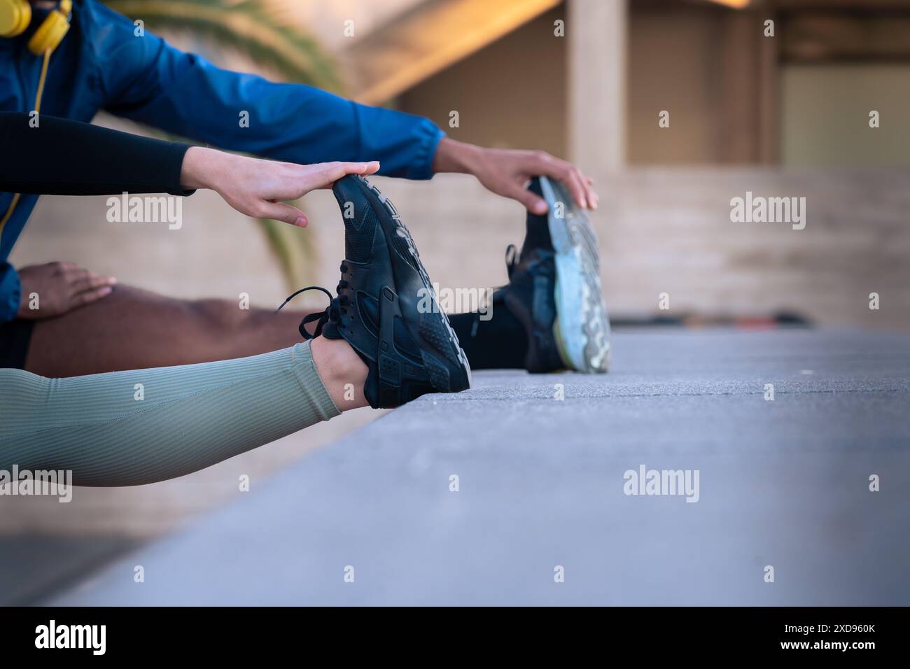 Unrecognizable young couple doing stretching. Stock Photo