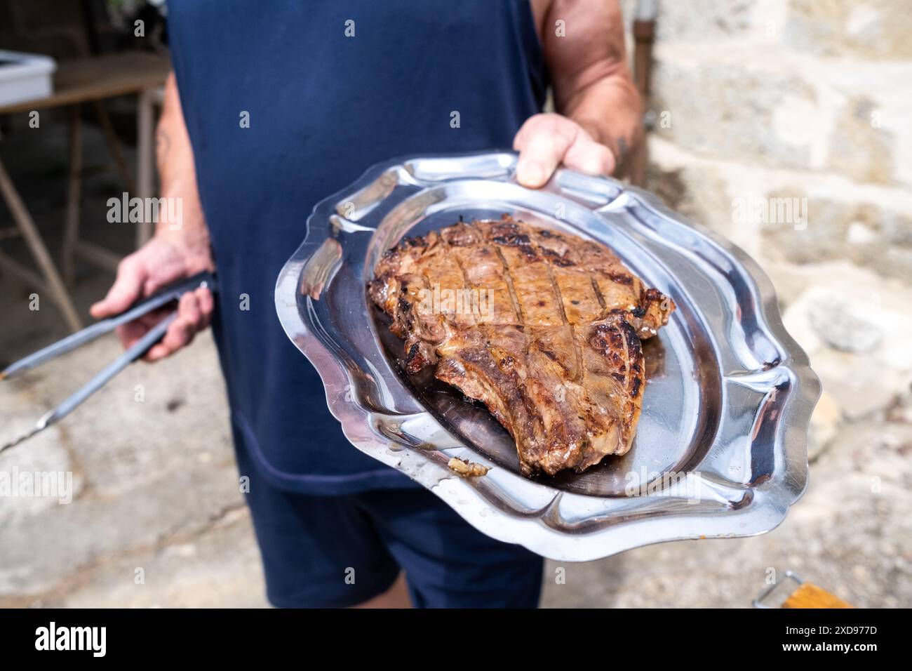 Grilled meat barbecue with beef entrecote in a house in the village of