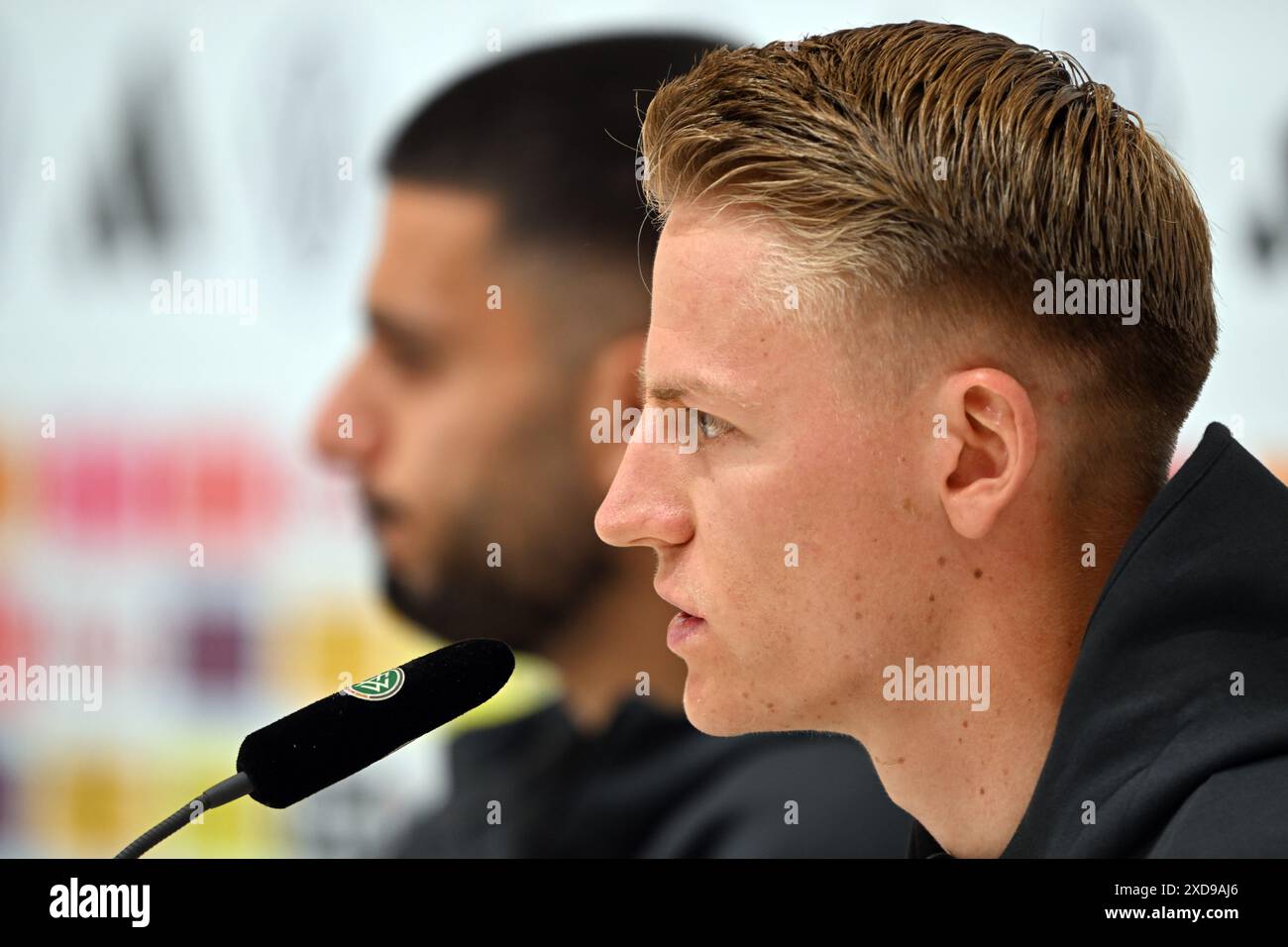 Herzogenaurach, Germany. 21st June, 2024. Soccer: European Championship, national team, before the last group match against Switzerland, Germany's Chris Führich (r) answers questions from journalists. Credit: Federico Gambarini/dpa/Alamy Live News Stock Photo