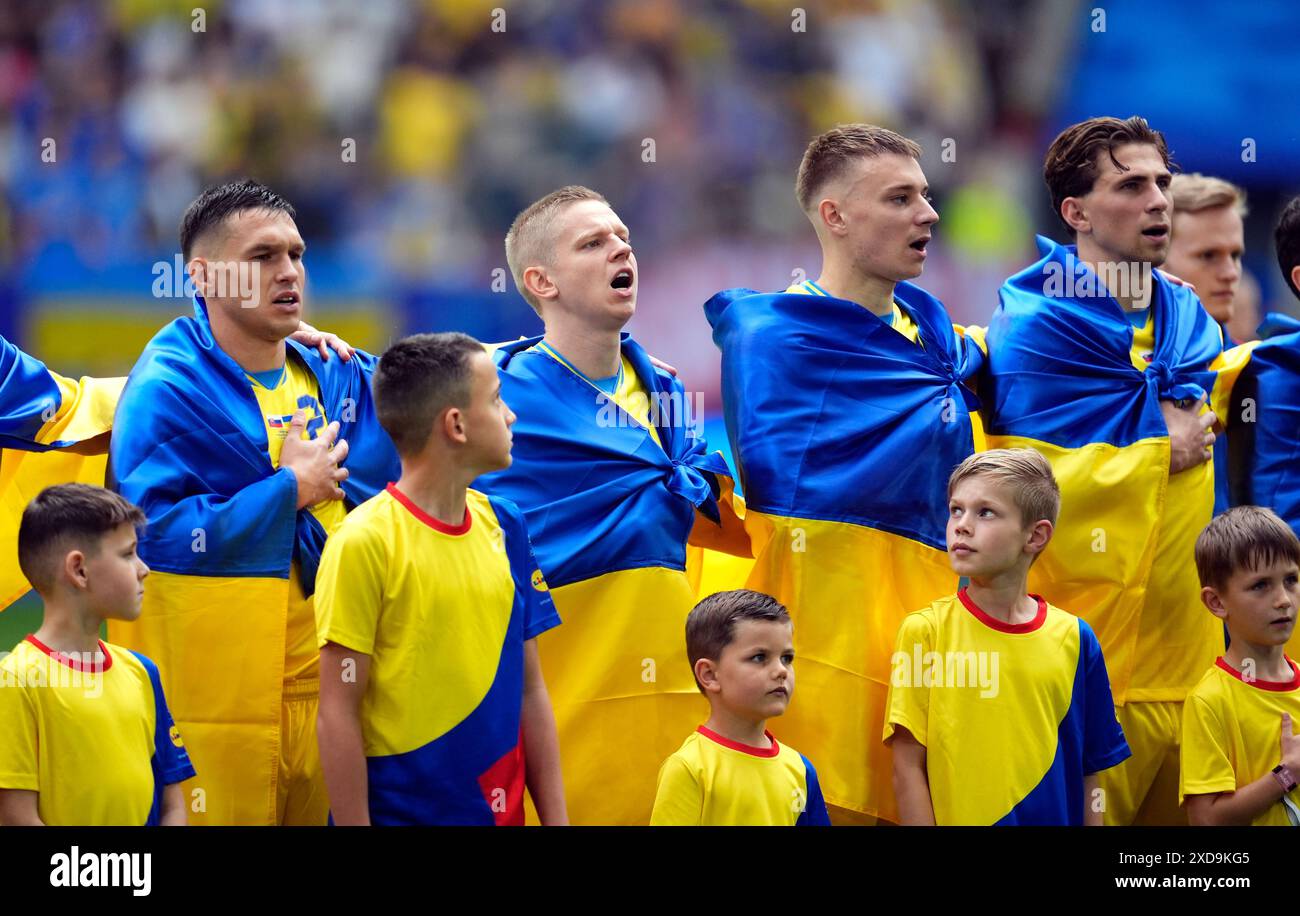 Ukraine's Oleksandr Zinchenko alongside team mates as they sing the