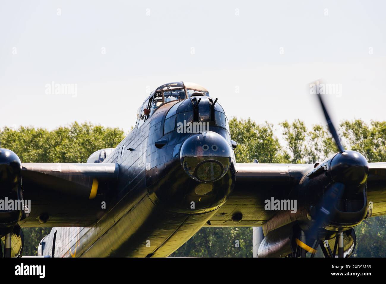 Royal Air Force Avro Lancaster Mk7, Just Jane, NX611 at RAF East Kirkby Aviation centre. Lincolnshire, England. With engines running and prop blur. Stock Photo