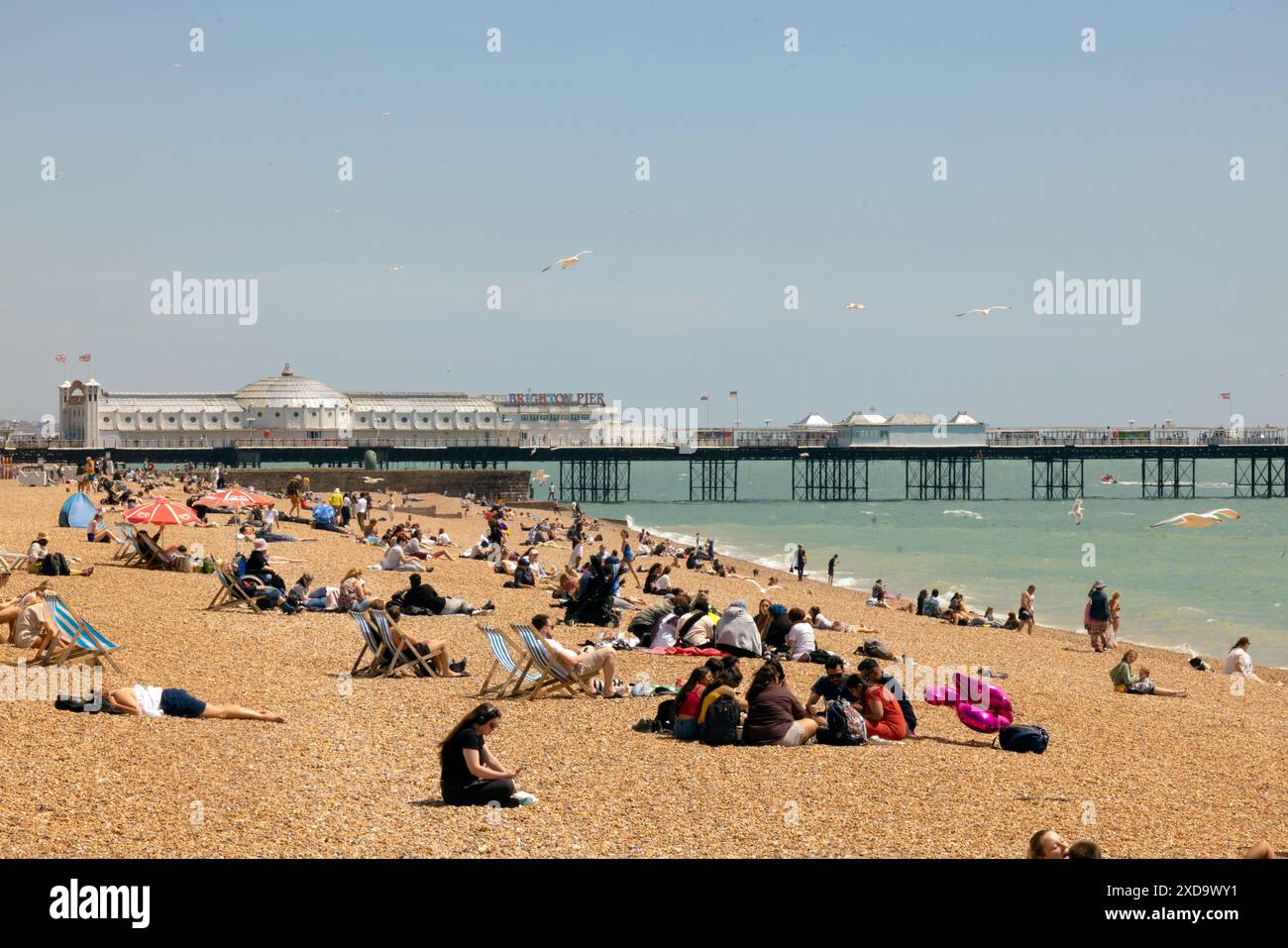City of Brighton & Hove, East Sussex, UK. Sun seekers go down to the ...
