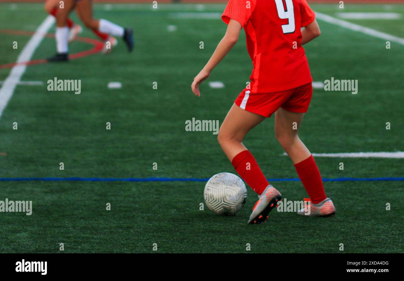 Footballer dribbling soccer ball hi-res stock photography and images ...