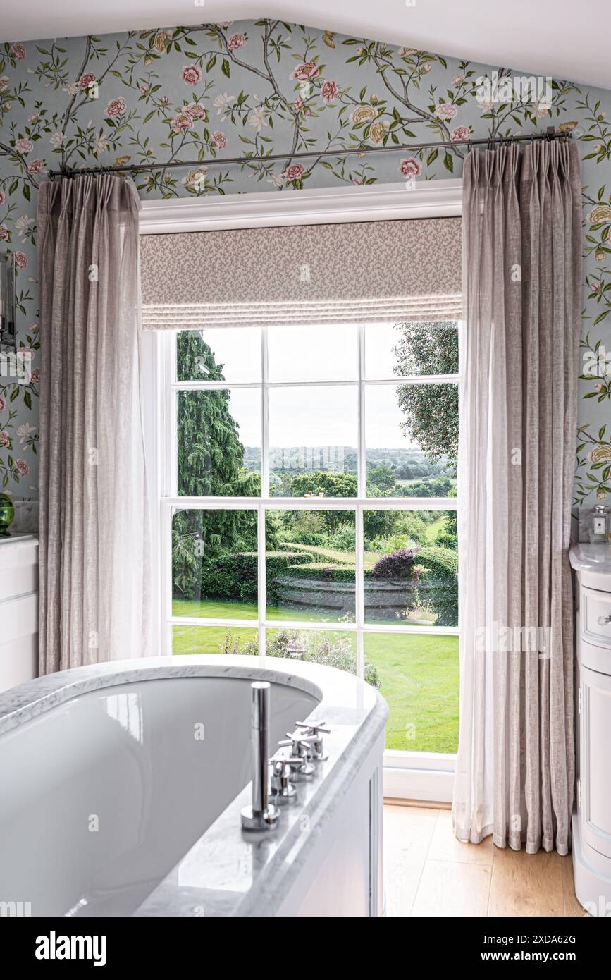 Luxury bathroom with view to garden from 16th century country house ...