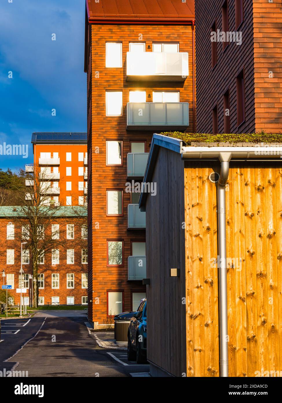 A view of modern brick apartment buildings with balconies in a ...