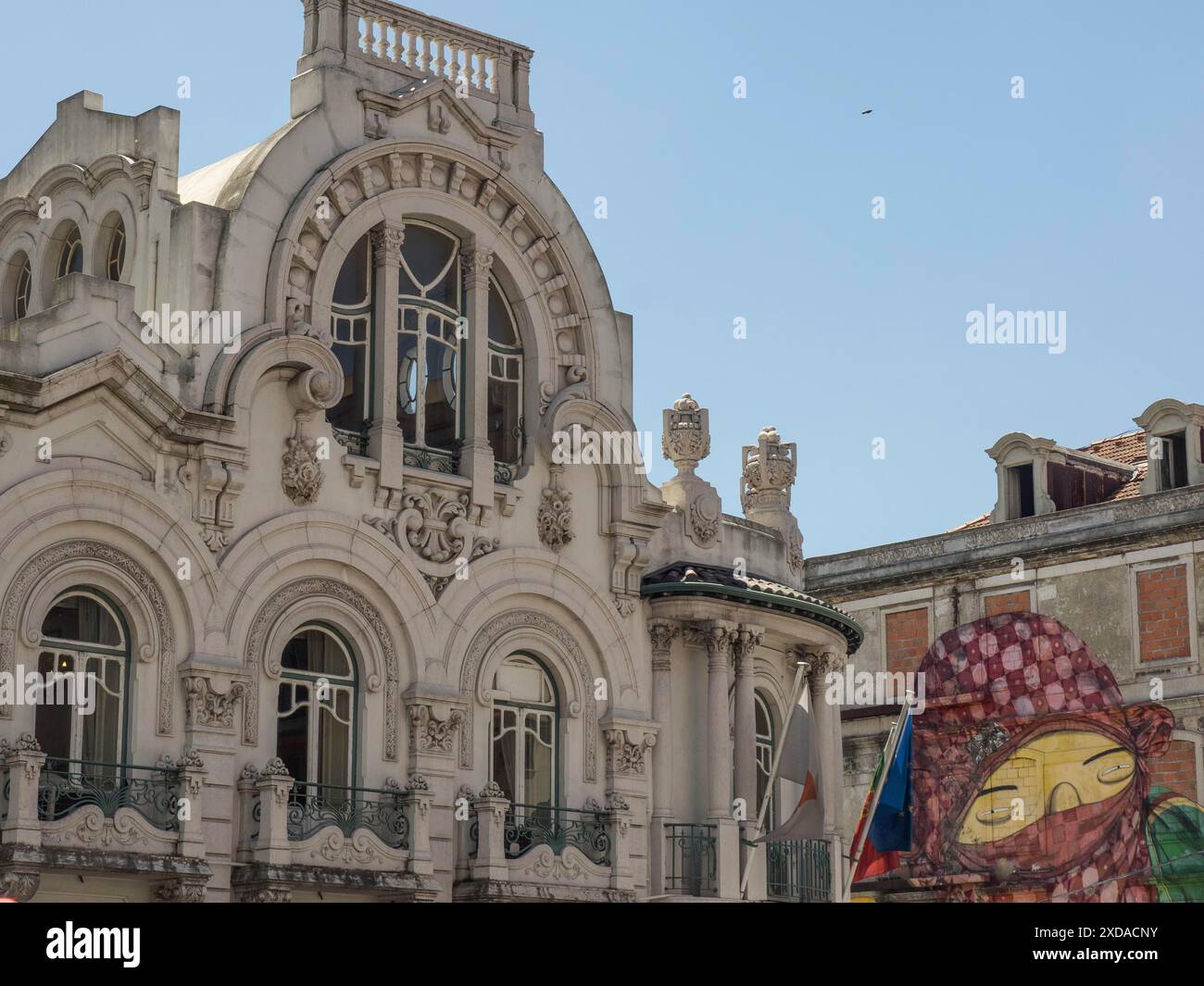Historic facade with ornate arched windows and balconies in the city ...