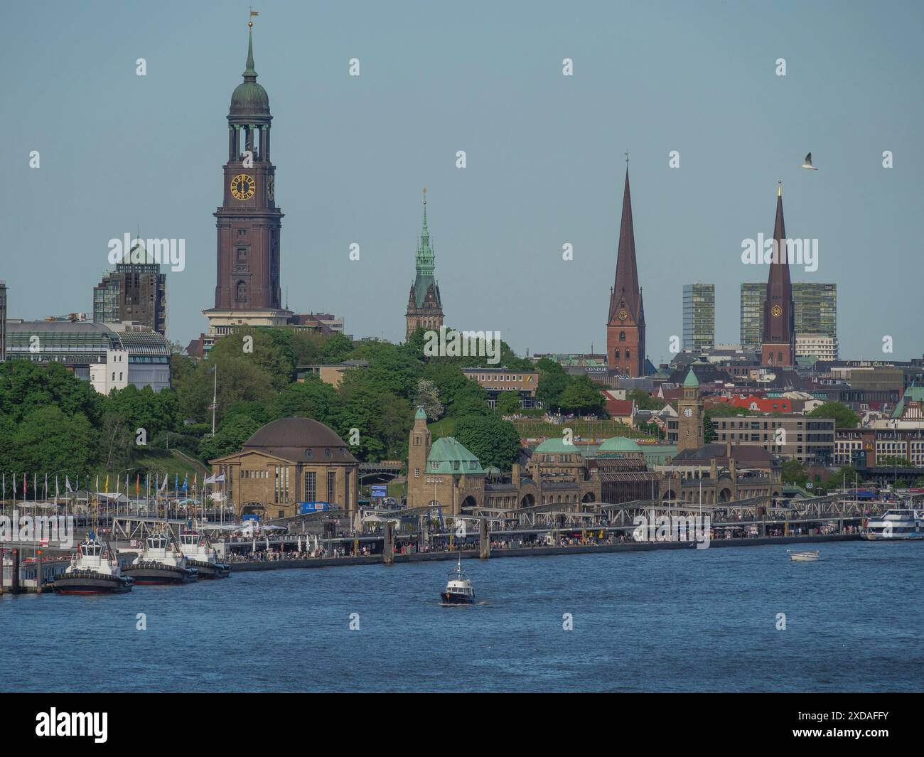 historic-harbour-with-churches-and-towers-along-the-river-under-a-clear