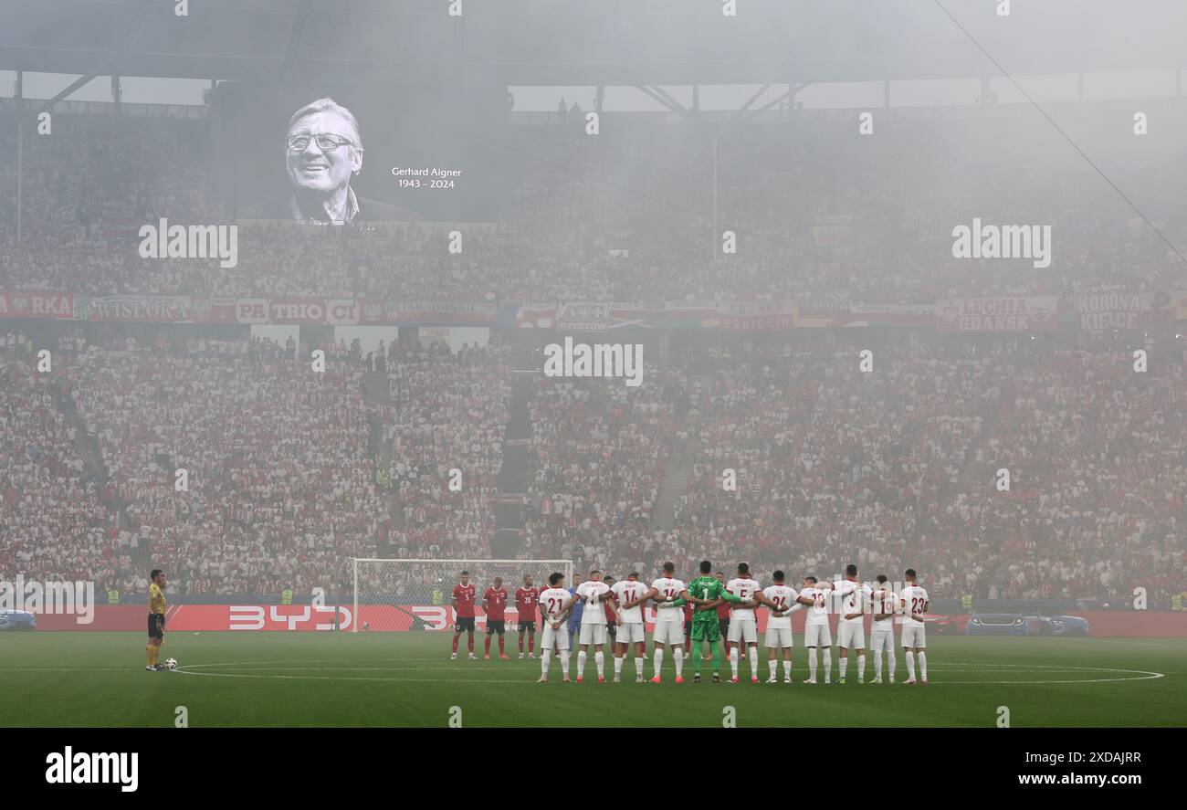 Berlin, Germany. 21st June, 2024. Soccer, UEFA Euro 2024, European Championship, Poland - Austria, Preliminary round, Group D, Matchday 2, Olympiastadion Berlin, The players of both teams stand on the pitch during a minute's silence for former UEFA official Gerhard Aigner. Credit: Andreas Gora/dpa/Alamy Live News Stock Photo