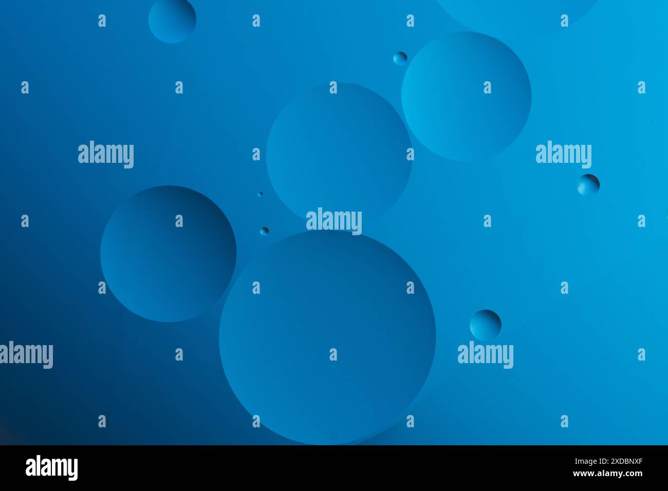 Abstract blue background with dynamic circles of different sizes Stock Photo
