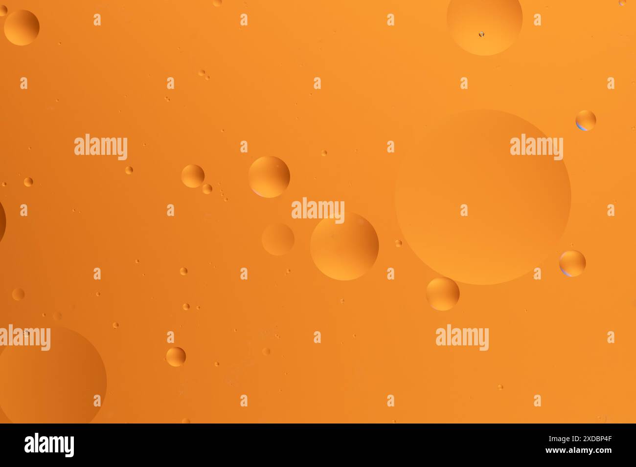Abstract art featuring vibrant orange hues with bubble like forms Stock Photo