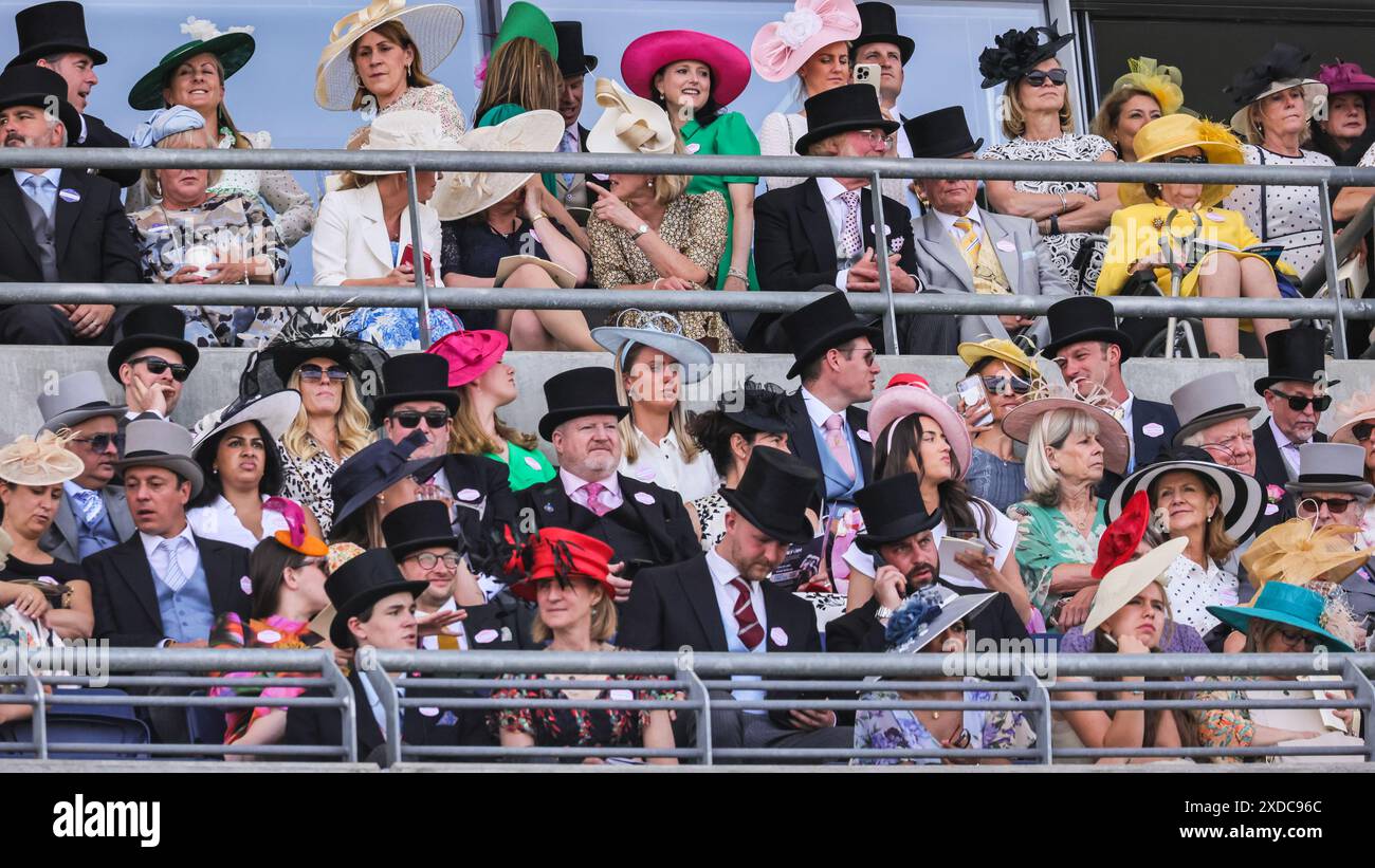 Ascot, Berkshire, UK. 21st June, 2024. Racegoers watch one of the races ...