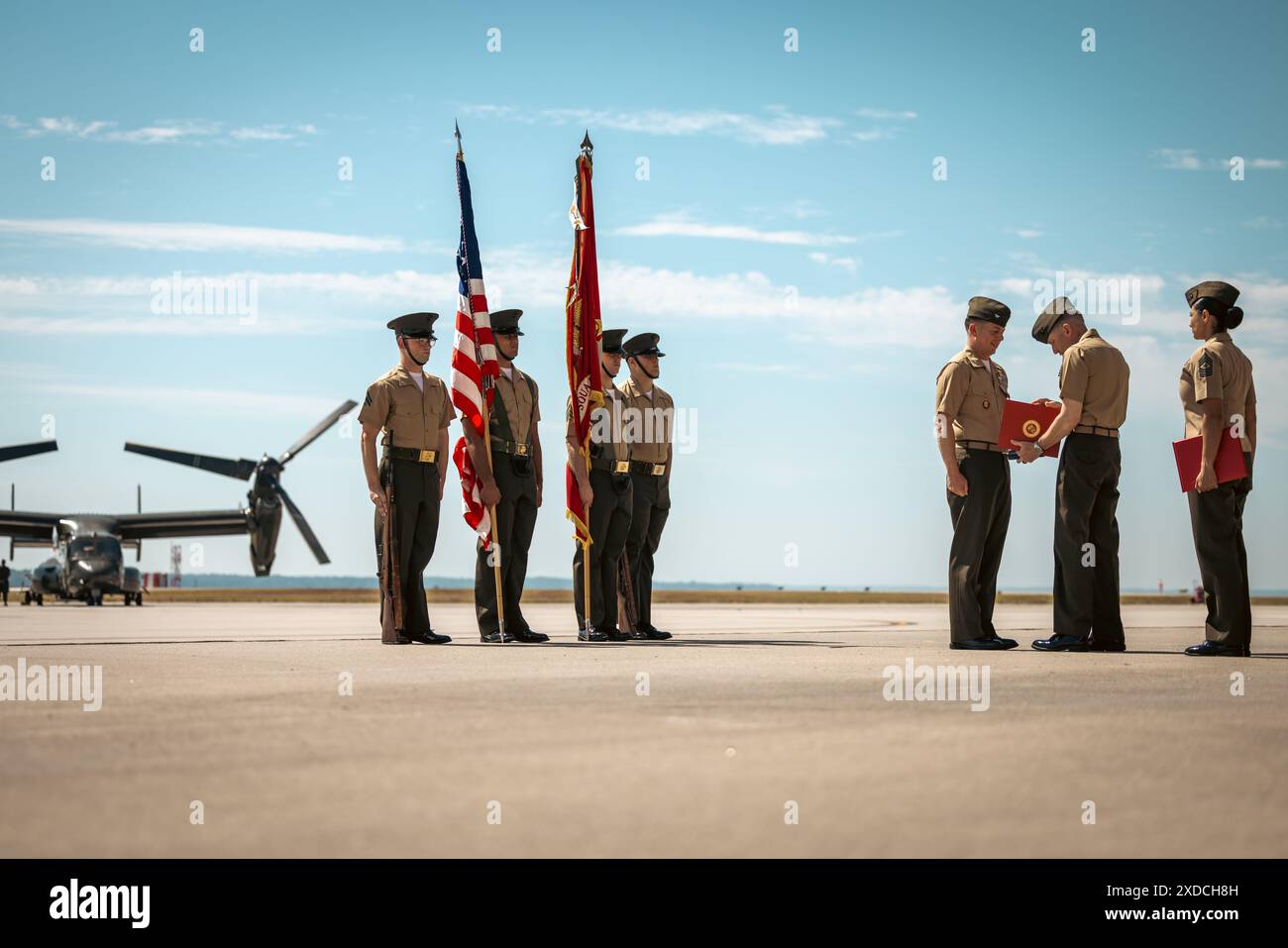 U.S. Marine Corps Col. Bradley Harms, the outgoing commanding officer of Marine Helicopter Squadron One, left, receives a Legion of Merit award during a change of command ceremony on Marine Corps Base Quantico, Virginia, June 21, 2024. Ryan Shadle relieved Harms after serving HMX-1 as its commander for over two and half years. (U.S. Marine Corps photo by Lance Cpl. Joaquin Dela Torre) Stock Photo