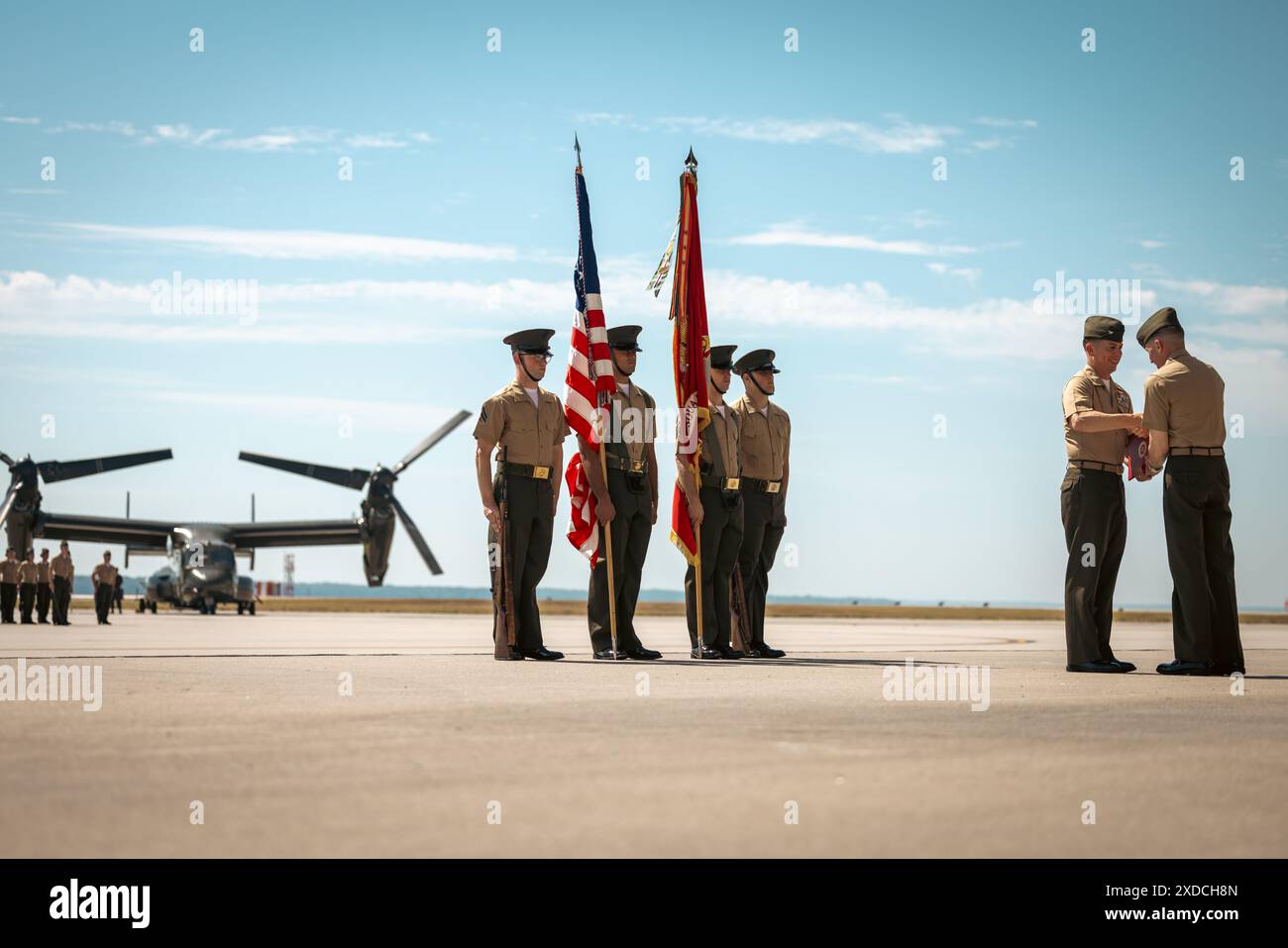 U.S. Marine Corps Col. Bradley Harms, the outgoing commanding officer of Marine Helicopter Squadron One, left, receives a Legion of Merit award during a change of command ceremony on Marine Corps Base Quantico, Virginia, June 21, 2024. Ryan Shadle relieved Harms after serving HMX-1 as its commander for over two and half years. (U.S. Marine Corps photo by Lance Cpl. Joaquin Dela Torre) Stock Photo