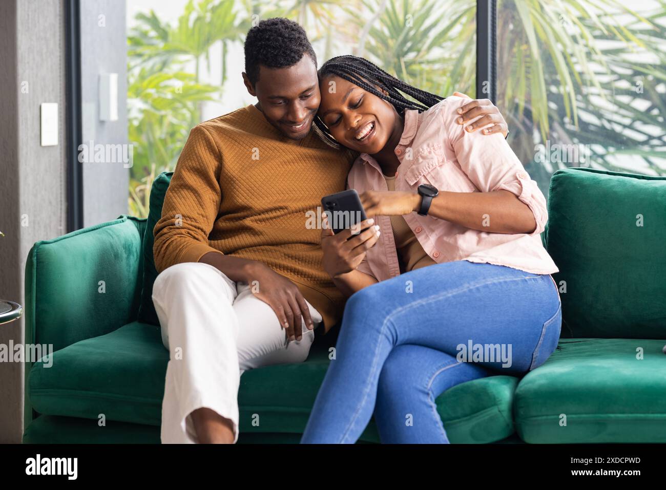 Young black family chatting hi-res stock photography and images - Alamy