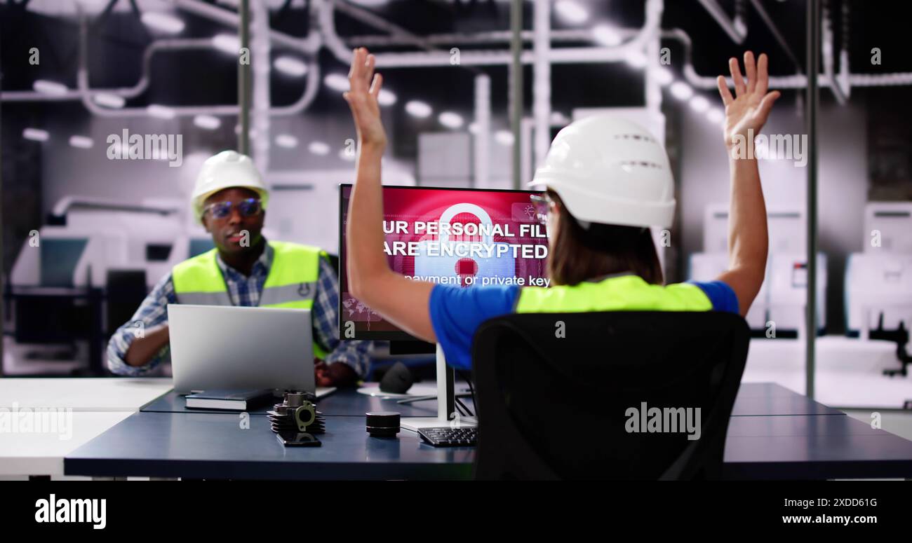 Shocked Engineer In Automated Semiconductor Factory During Ransomware Attack Stock Photo