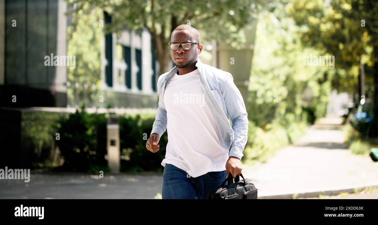Fast-paced African businessman navigating city streets, young analyst juggling tasks in office, real estate agent finalizing deals. Multitasking profe Stock Photo