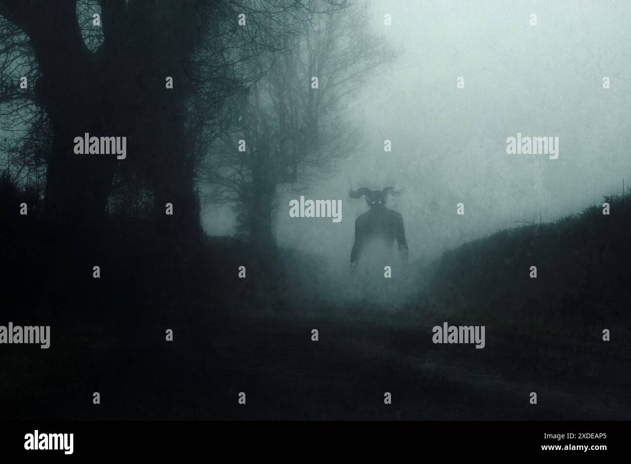 A supernatural demon.  standing on a road. On a spooky foggy night in the countryside. With a grunge abstract edit. Stock Photo