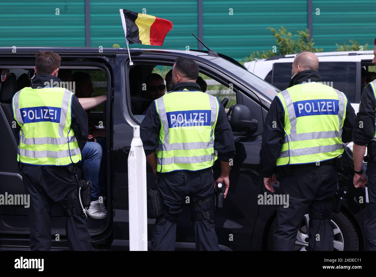 Aachen, Germany. 22nd June, 2024. Police officers check a vehicle from ...