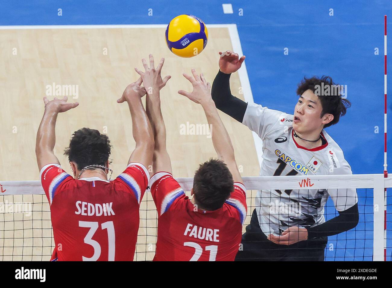 Pasay City, Philippines. 22nd June, 2024. Ishikawa Yuki (R) of Japan spikes the ball during the match between Japan and France at the Men's Volleyball Nations League (VNL) 2024 in Pasay City, the Philippines, on June 22, 2024. Credit: Rouelle Umali/Xinhua/Alamy Live News Stock Photo