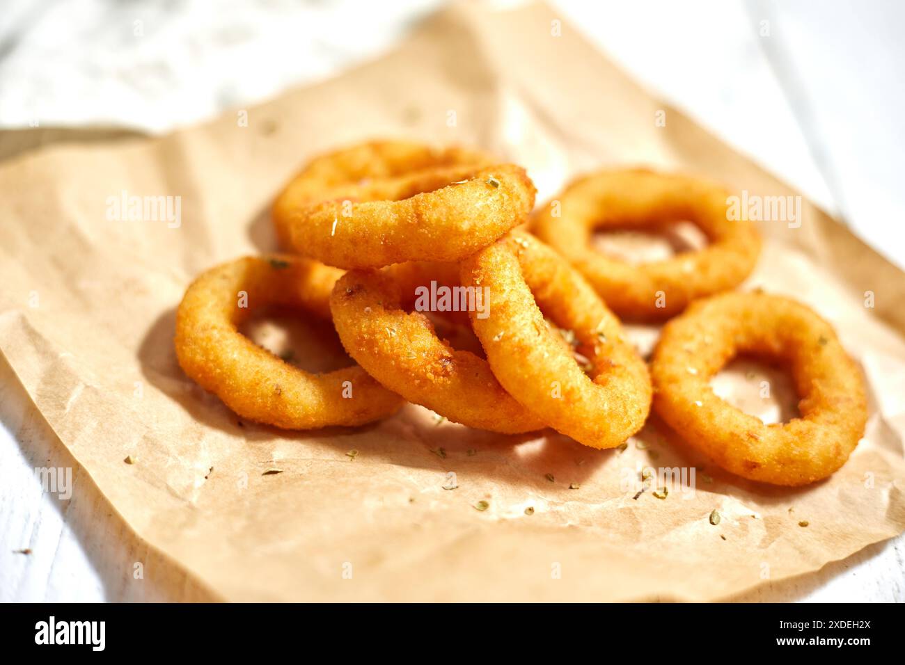 Fried breaded onion rings on white background Stock Photo