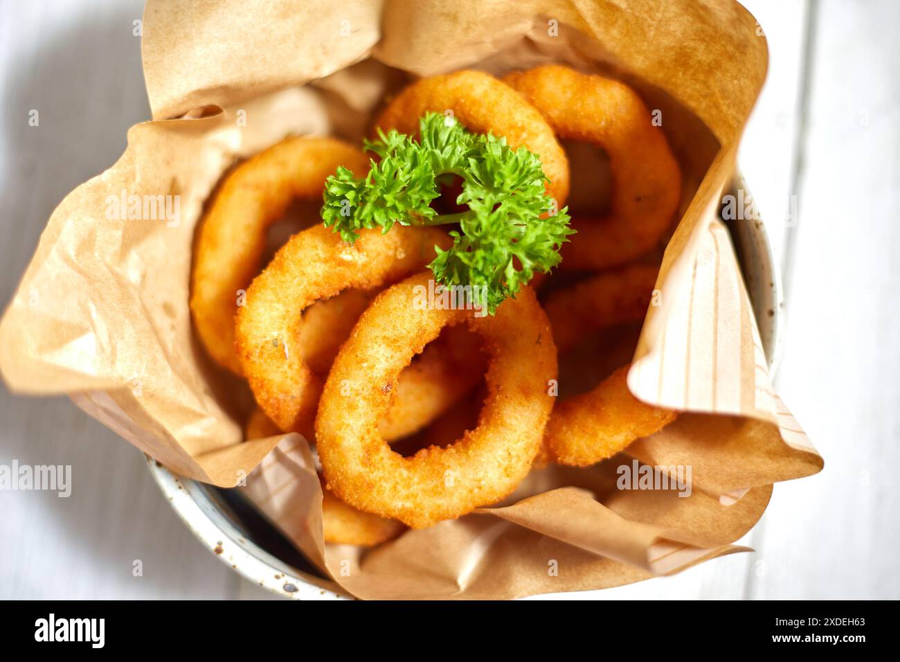 Fried breaded onion rings on white background Stock Photo