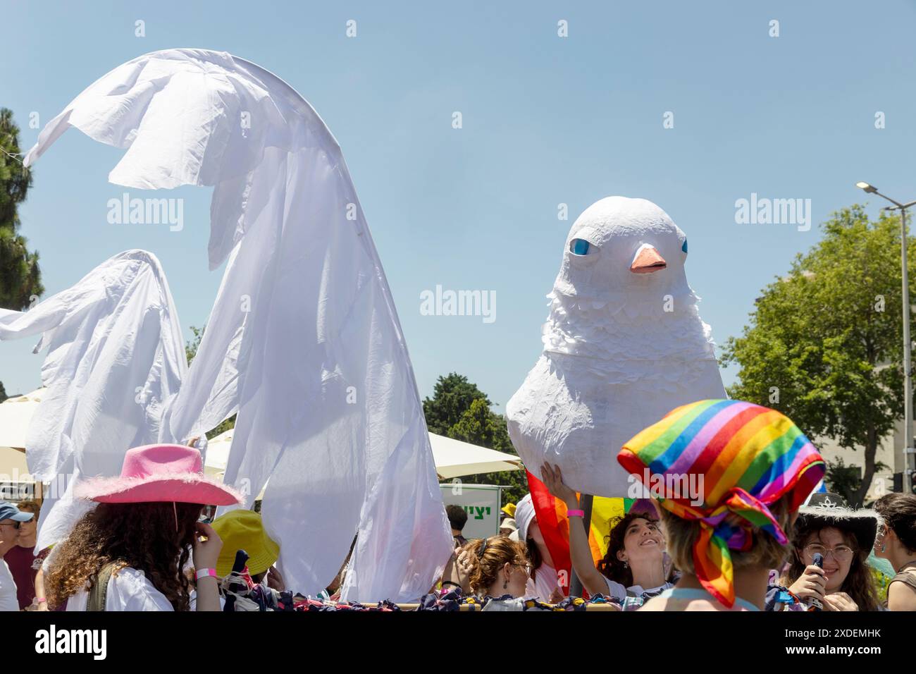 Haifa, Israel June 21, 2024, Pride. A girl holds a papier-mache dove ...