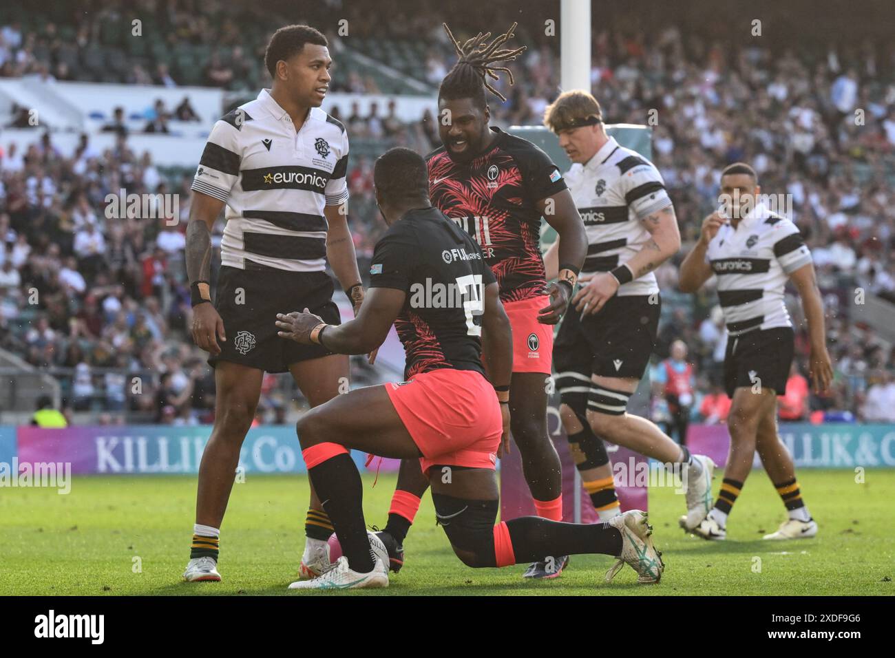 Kemueli Valetini of Fiji celebrates his try to make it 3127 during the