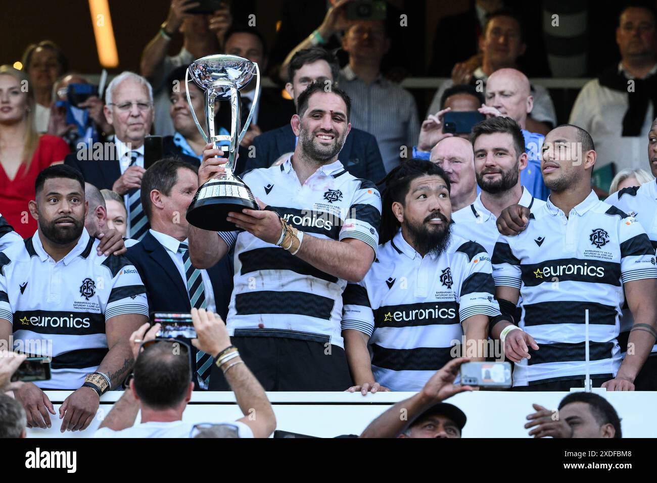 Sam Whitelock of Barbarians lifts the trophy during the Killik Cup