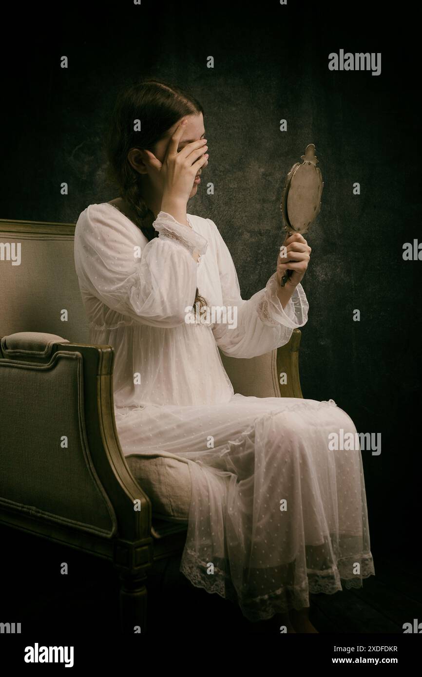Woman holding vintage hand mirror hi-res stock photography and images ...