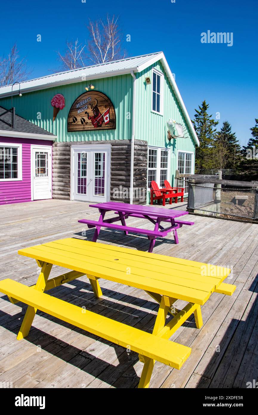 Colorful picnic tables at the wharf village at Magnetic Hill in Moncton, New Brunswick, Canada Stock Photo