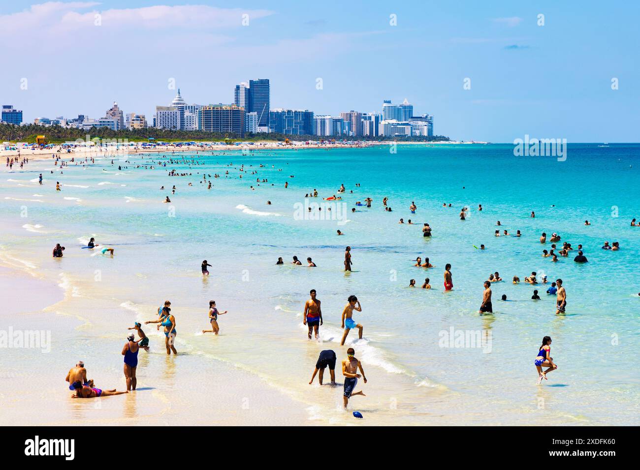 Swimming the the ocean on a hot day at Playa Miami Beach, South Beach, Miami Beach, Florida, USA Stock Photo