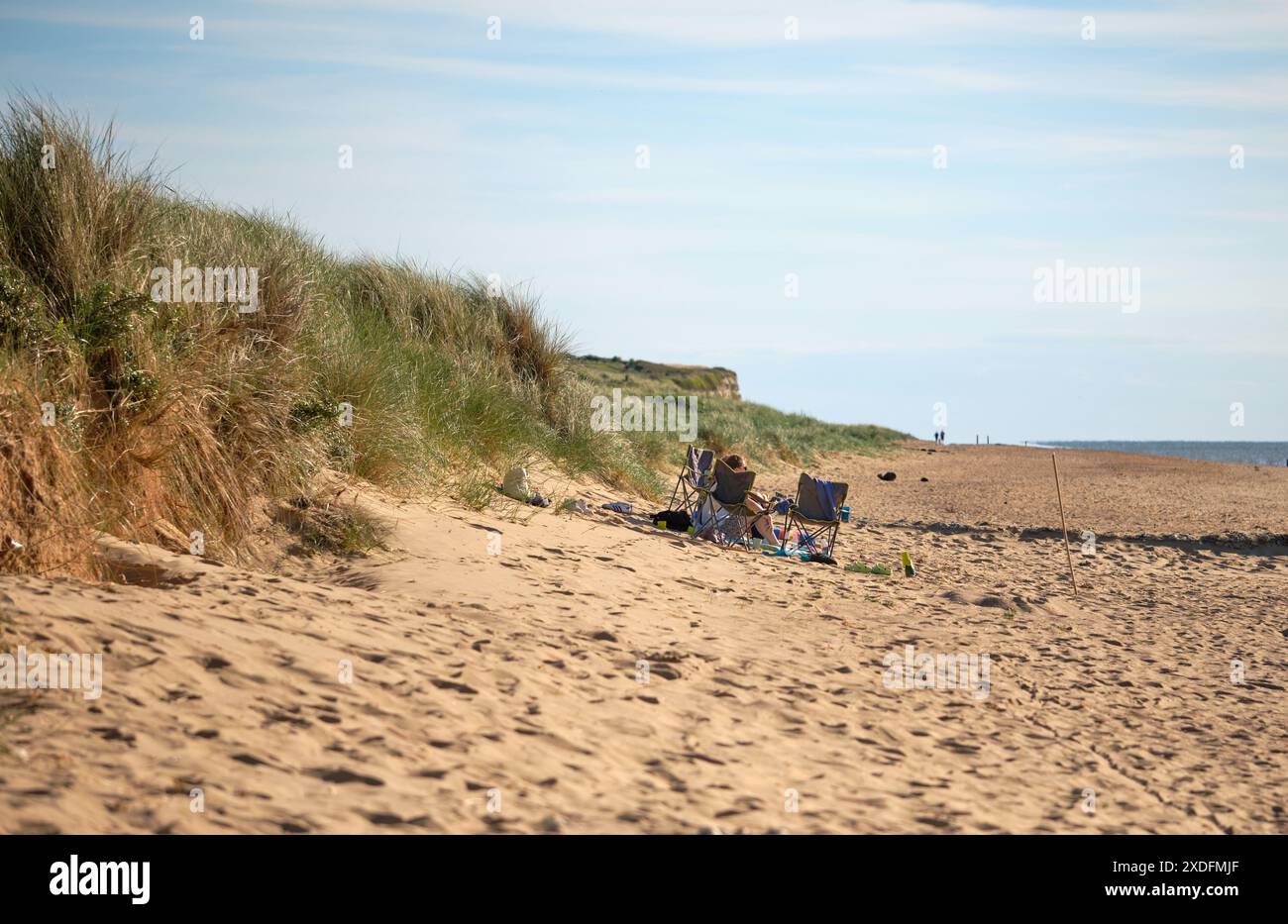 Couple on a beach in Old Hunstanton, Norfolk, UK Stock Photo