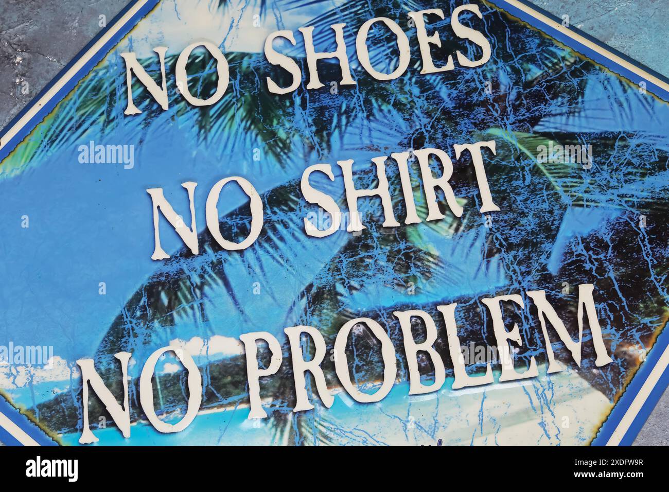 Viersen, Germany - May 9. 2024: Detail closeup of Jimmy Buffett Margaritaville Jamaica metal sign with Kenny Chesney song slogan no shoes, no shirt, n Stock Photo