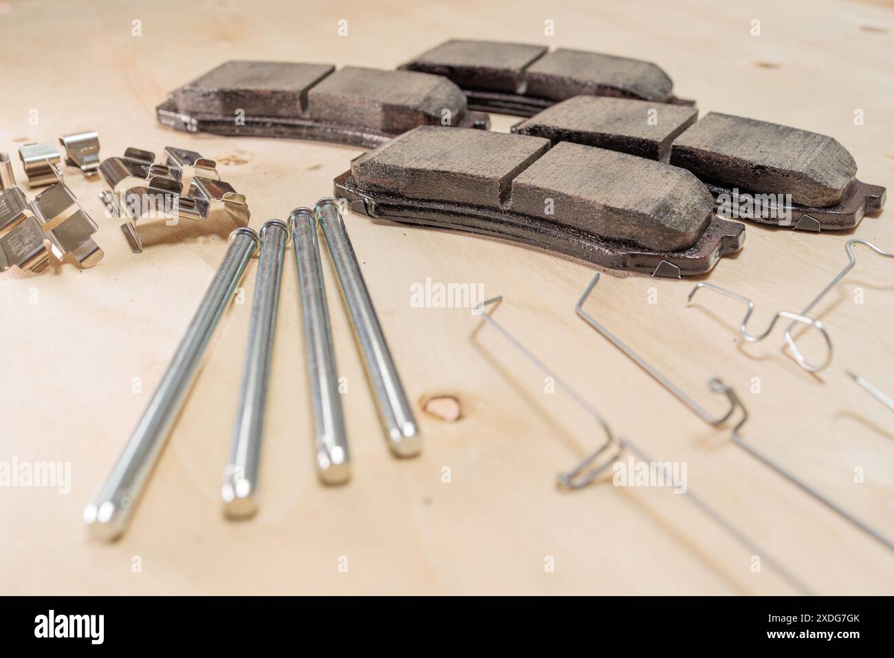 Brake Replacement Kit Showing Brake Pads, Caliper Pins, Shims, Wear