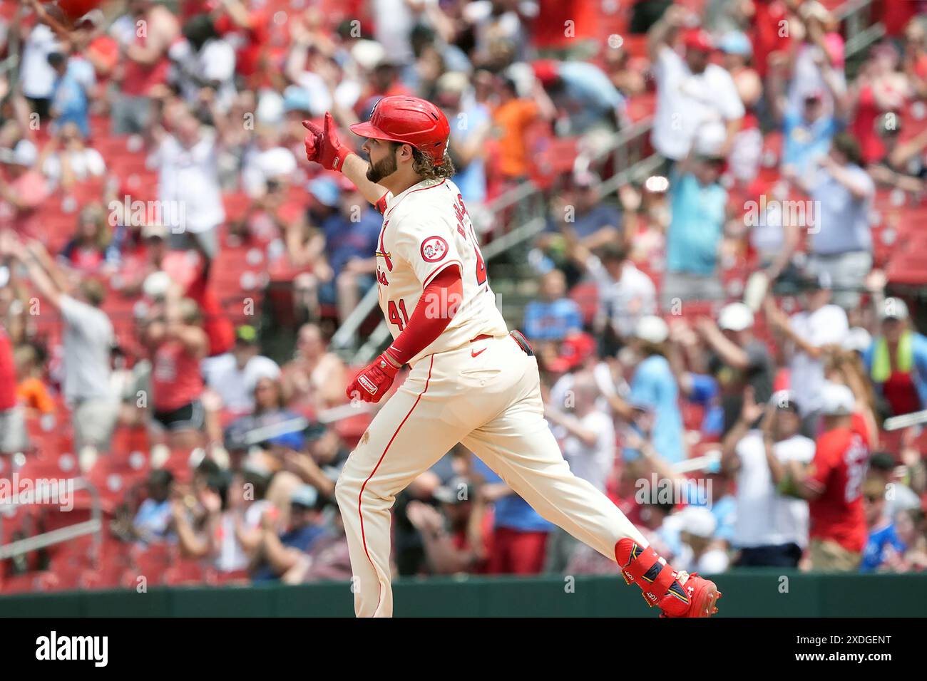 St. Louis Cardinals Alec Burleson points as he rounds first base ...