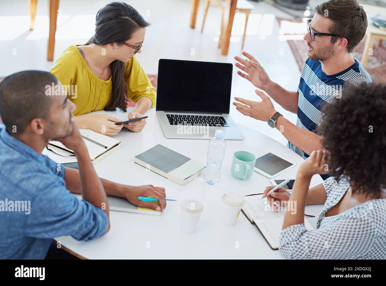 Laptop, brainstorming and team of creative business people in meeting ...