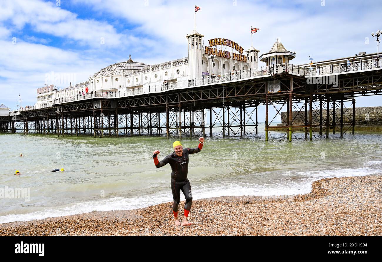 Brighton UK 23rd June 2024 Swimmers finish the annual Brighton Pier