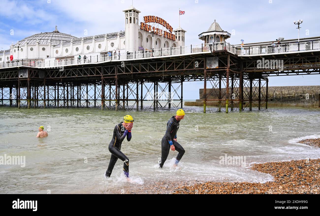 Brighton UK 23rd June 2024 Swimmers finish the annual Brighton Pier