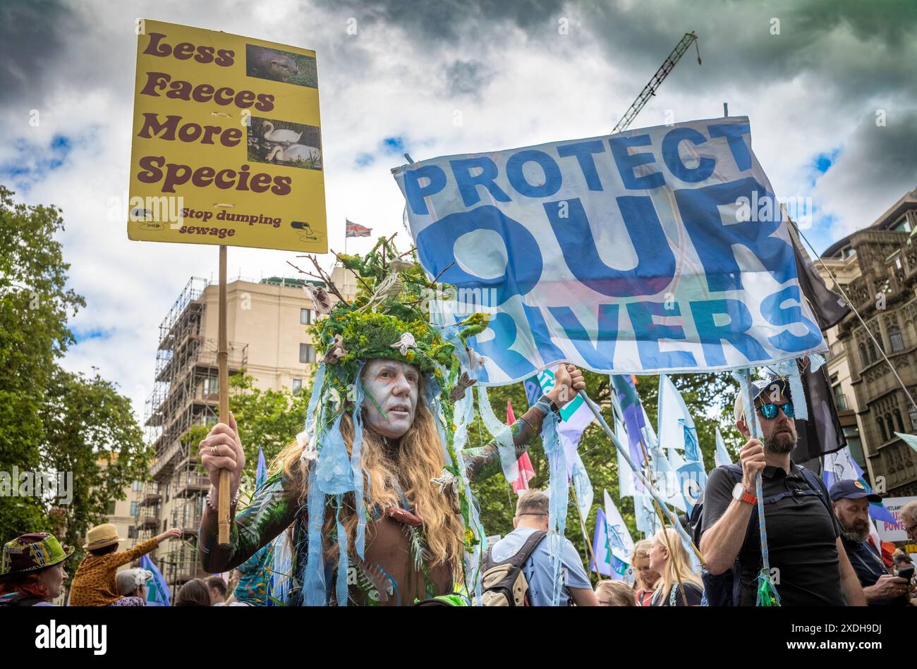 London / UK - Jun 22 2024: An activist protests for clean rivers at the Restore Nature Now march for environmental protections. 350 ogroups including the RSPB, WWF,  National Trust, Extinction Rebellion and others united for the march. Stock Photo