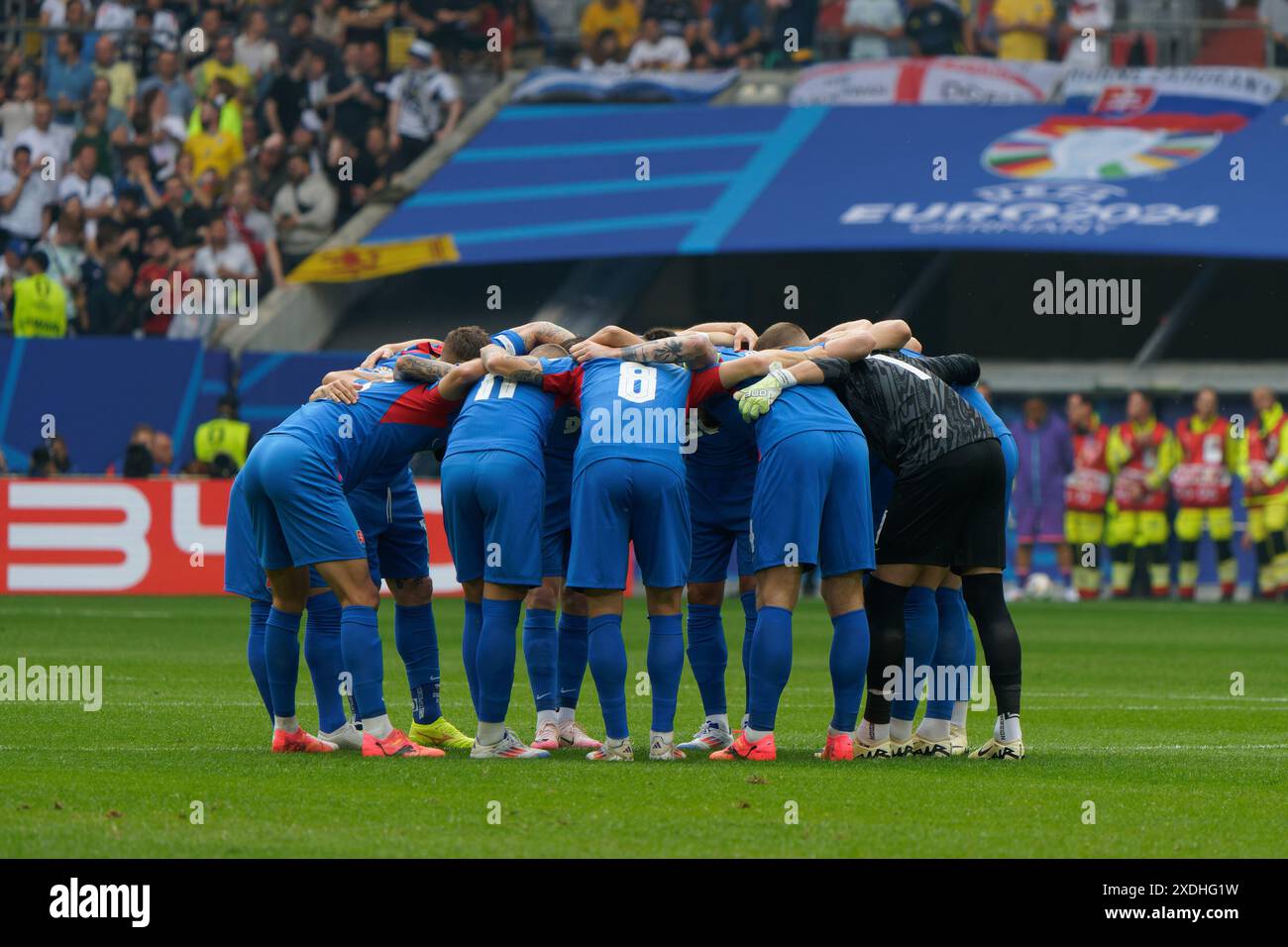The Slovakia players hug each other during UEFA Euro 2024 - Slovakia vs