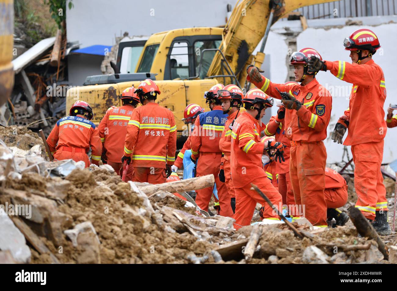 Xinhuang, China's Hunan Province. 23rd June, 2024. Rescuers work at the site of a landslide in Douxi Village, Xinhuang Dong Autonomous County of Huaihua City, central China's Hunan Province, June 23, 2024. The landslide occurred in Douxi Village at 4:30 a.m. on Sunday causing the collapse of four houses. The eight residents previously reported as missing have all been confirmed dead. Credit: Chen Zhenhai/Xinhua/Alamy Live News Stock Photo