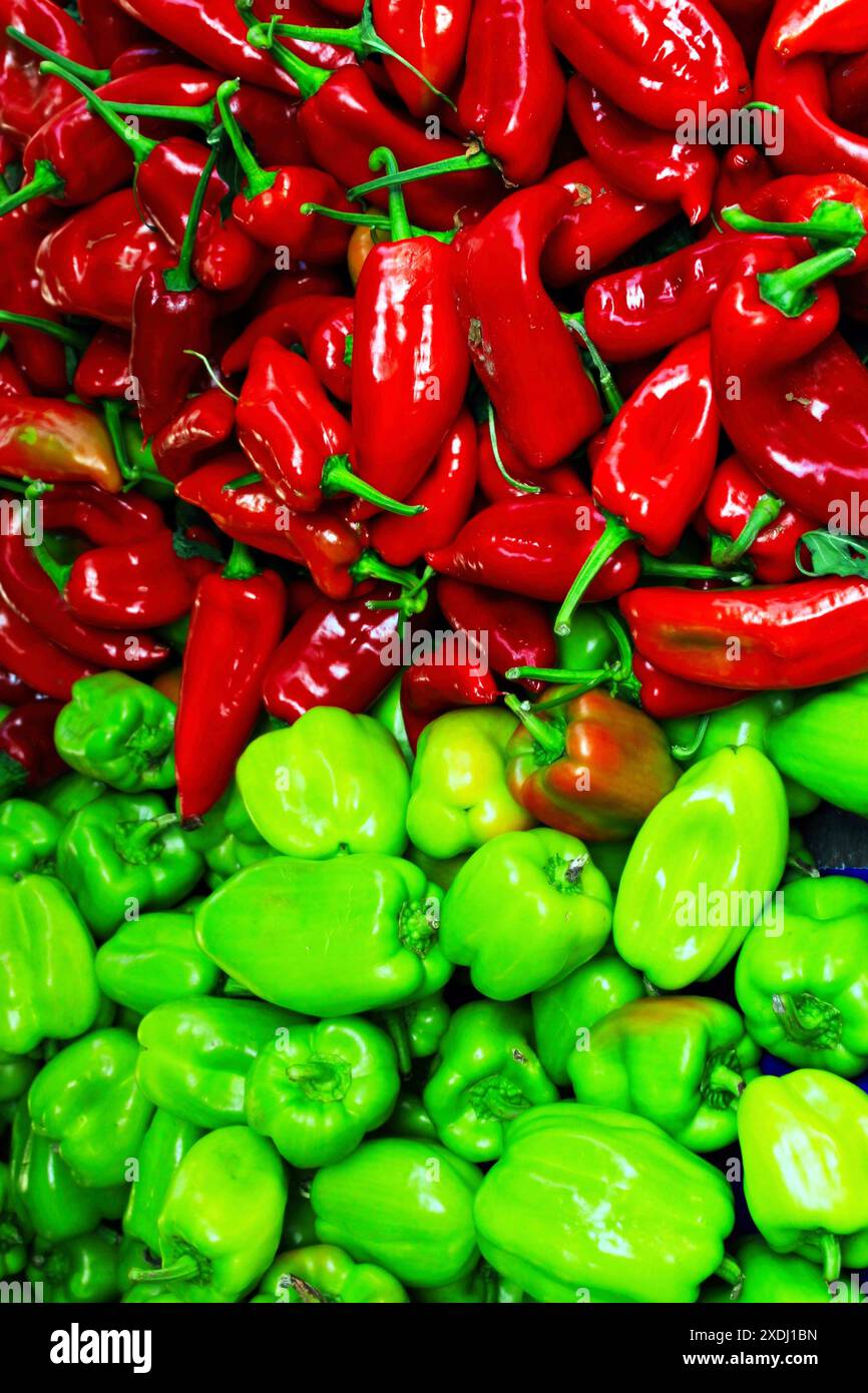 A collection of green and red peppers at a street market stall Stock ...
